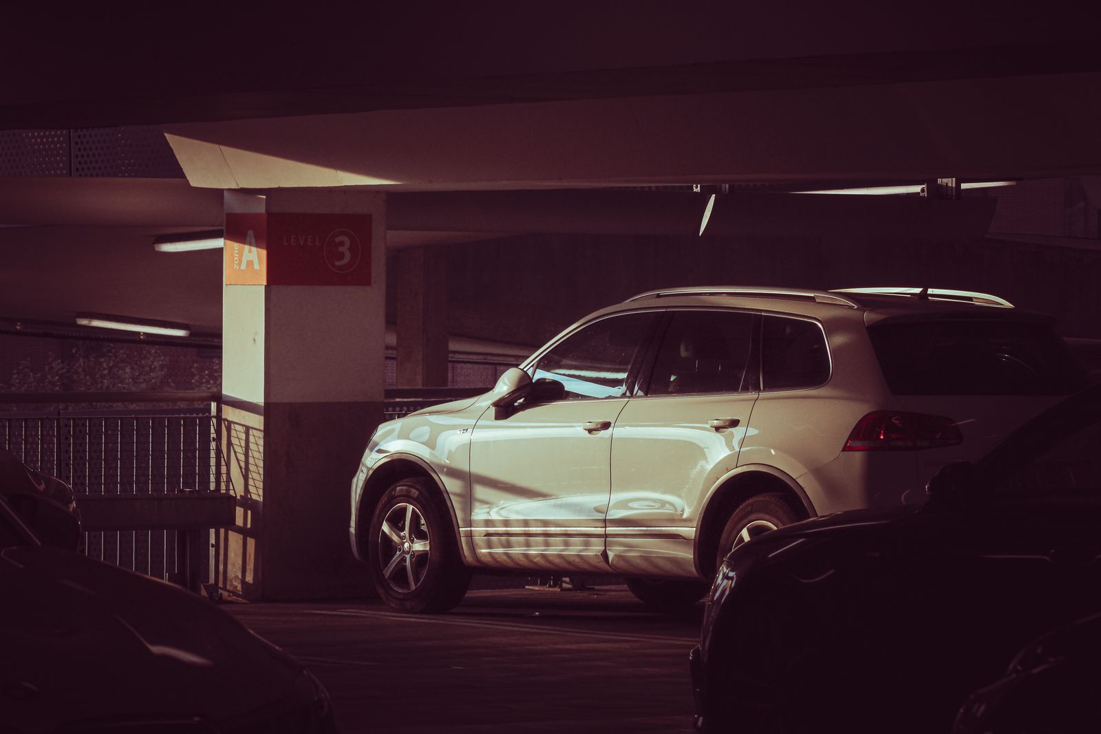 White SUV parked in a garage