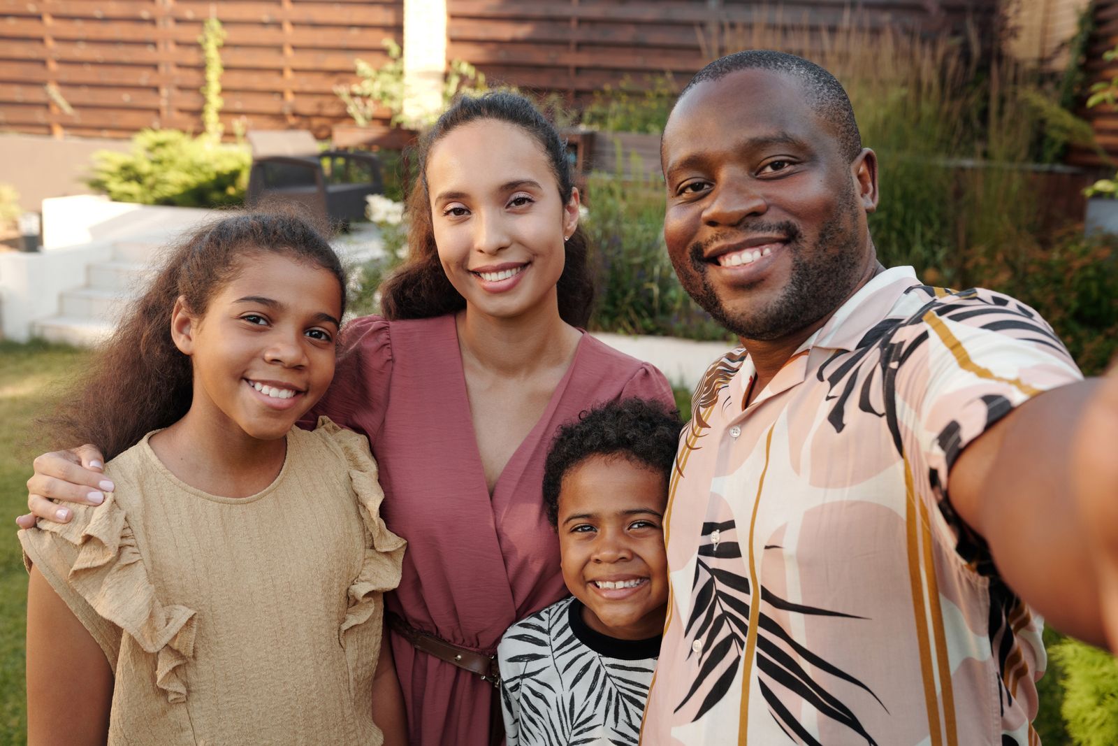 Smiling family together in their garden